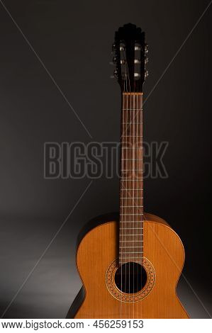 Classical Guitar On Grey Background With Copy Space