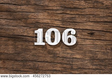 Number 106 In Wood, Isolated On Rustic Background
