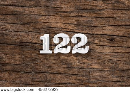 Number 122 In Wood, Isolated On Rustic Background