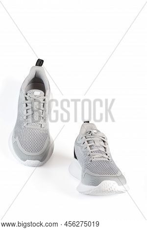 New Unbranded Running Sneaker Or Trainer Isolated On White Background. Men's Light Grai Sport Footwe