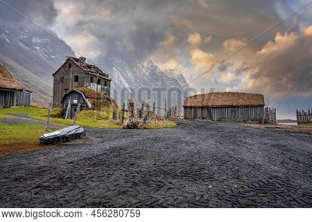 Wooden Houses In Historic Viking Village Under Vestrahorn Mountain At Sunset