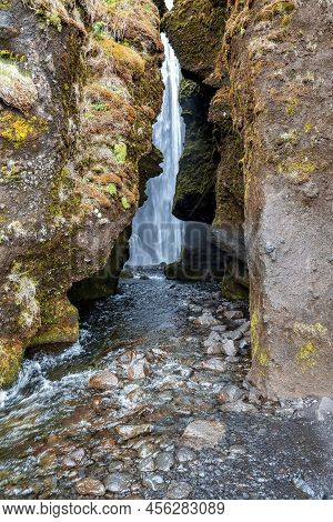 Close-up Of Hidden Gljufrafoss Seen From Cliffs Flowing Through Stream