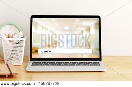 Labtop Computer With Www. On Search Bar Over Blur Store Background On Screen, On Line Shopping ,busi