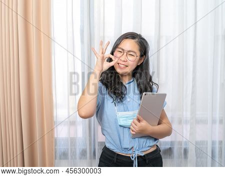 Ok Gesture Poses From An Asian Beauty Woman With A Tablet Computer, Mobile And A Control Telework Vi