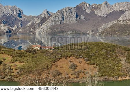 Picturesque Reservoir And Mountain Landscape In Riano. Mirror Effect. Spain