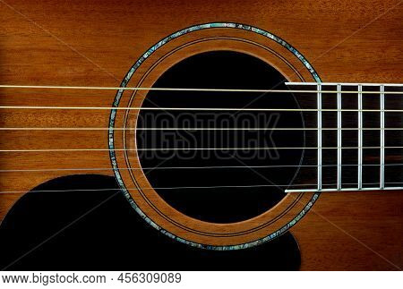 Closeup View Of Mahogany Acoustic Guitar Inlay And Soundhole