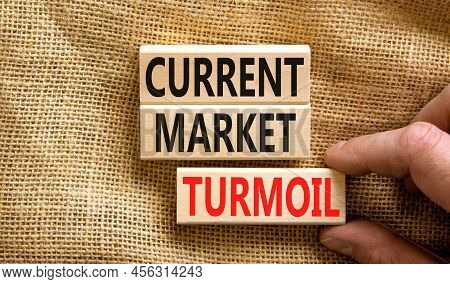 Current Market Turmoil Symbol. Concept Words Current Market Turmoil On Wooden Blocks On A Beautiful 