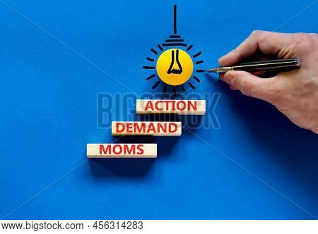 Moms Demand Action Symbol. Concept Words Moms Demand Action On Wooden Blocks On A Beautiful Blue Tab