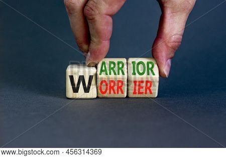 Be Warrior Not Worrier Symbol. Concept Words Warrior And Worrier On Wooden Cubes. Businessman Hand. 
