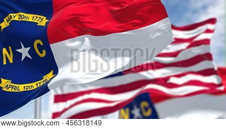 The North Carolina State Flag Waving Along With The National Flag Of The United States Of America. I