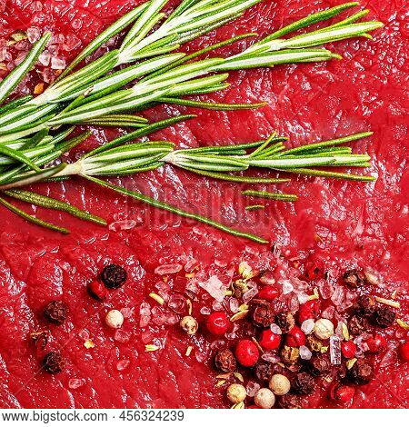 Fresh Beef Steak As A  Background, Top View. Meat Patttern With Spices And Herbs