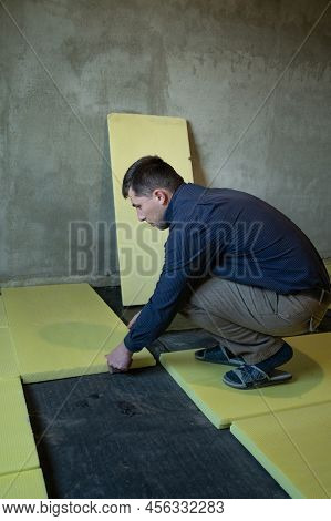 Installation Of Expanded Polystyrene For Floor Insulation.