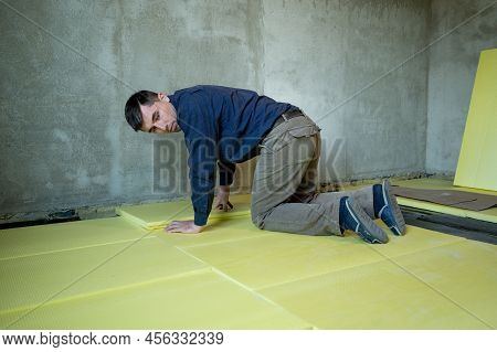 Installation Of Expanded Polystyrene In The Room For Floor Insulation, Repair Work Alone, Yellow Exp