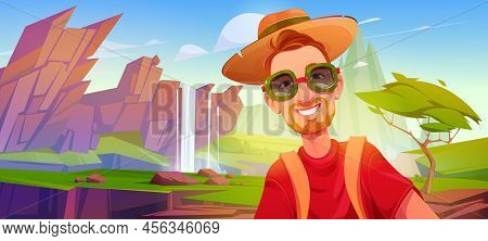 Tourist Man With Happy Smiling Face In Sunglasses Taking Photo At Scenery Landscape With Waterfall C