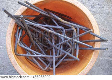 Steel Scraps In The Tank For Re-use. Steel For Construction, Wrought Iron