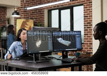 Digital Engineer Developing Prototype Mesh Using Modern Computer While Sitting At Desk In Office. Cr