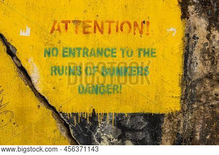 Attention - Danger Sign In Wolfs Lair. Former War Headquarters Of Adolf Hitler In Poland