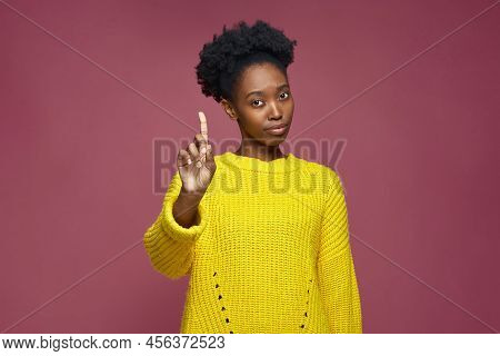 African American Girl Warning Raised Forefinger Up, Does Admonishing Gesture, Giving Advice To Avoid