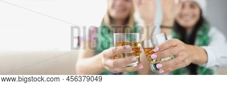Close-up Of Best Friends Do Clink With Glasses Filled With Champagne. Happy Women Wave With Hand And