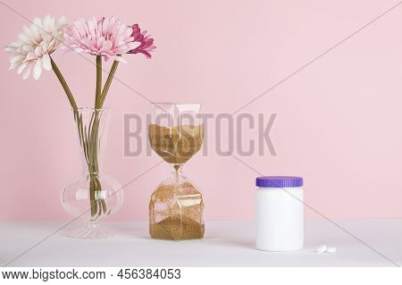 Women Health, Middle Age And Menopause Concept. Health Care Style. Copy Space. White Plastic Bottle 