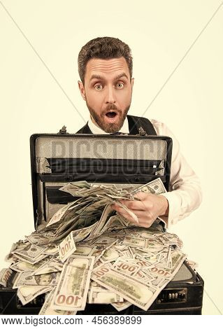 Financial Support. Investment. Shocked Businessperson With Money Case.