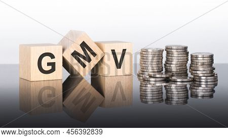 Gmv - Text Is Made Up Of Letters On Wooden Cubes Lying On A Mirror Surface