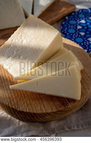 Spanish Hard Manchego, Cow, Sheep And Goat Cheese Served Outdoor In Morning Sunlights