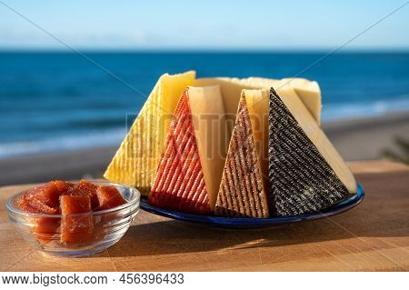 Assortment Of Spanish Hard Cheeses, Curado, Manchego, Goat Cheese Served Outdoor With Membrillo Jam
