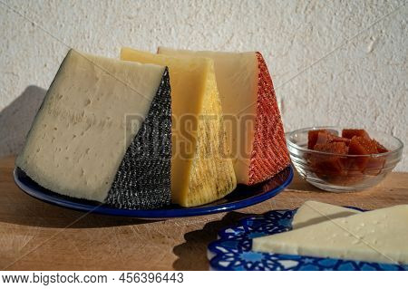 Spanish Hard Manchego, Cow, Sheep And Goat Cheeses Served Outdoor With Membrillo Jam In Sunlights