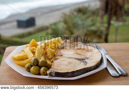 Seafood Dish Served In Beach Cafe With Sea View, Grilled Steak From Swordfish Or Spada Served With F