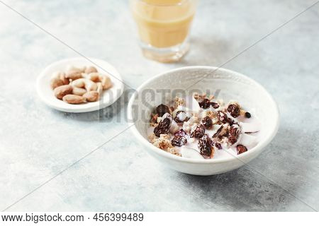 Bowl Of Granola With Yogurt, Nuts, Cranberry And Cocoanut. Concept For A Tasty And Healthy Meal. Sto