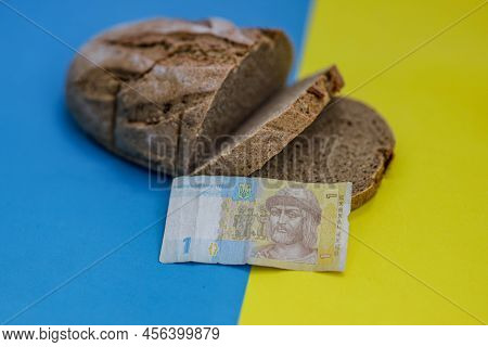 Homemade Baked Wheat Loaf Of Bread On National Ukrainian Flag Background, Yellow-blue Color With Hri