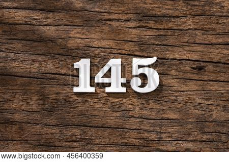 Number 145 - Piece On Rustic Wood Background
