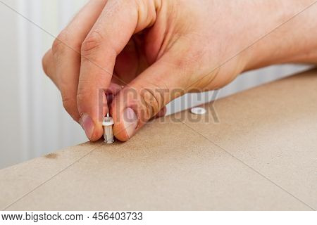 Professional Furniture Assembly Worker Assembles Shelf. Furniture Assembly Process. Diy Assembling