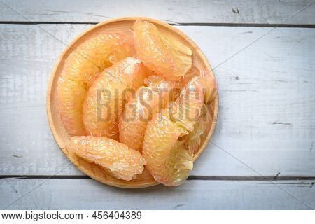 Pomelo Fruit On Wooden Plate, Fresh Pomelo Peeled Frome Pomelo Tree , Pummelo , Grapefruit In Summer