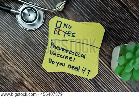 Concept Of Pneumococcal Vaccine. Do You Need It? Yes Write On Sticky Notes Isolated On Wooden Table.