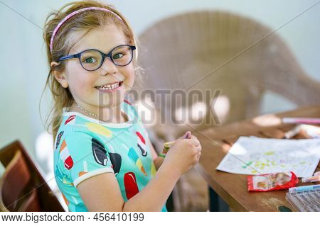 Happy Preschool Girl Learning Painting With Colorful Pencils And Felt Pens. Little Toddler Drawing A
