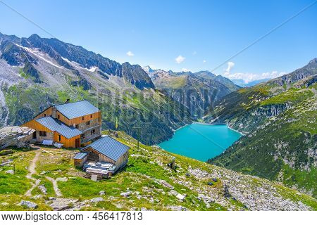 Alpine Walley With Plauener Hut And Azure Blue Water Of Speicher Zillergrundl Dam, Zillertal Alps, A