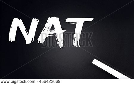 Nat Text On A Black Chalkboard With A Piece Of Chalk