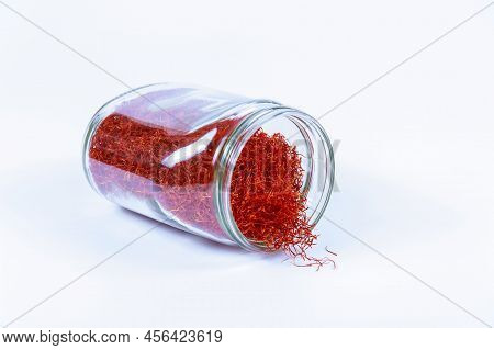 Saffron In A Glass Jar On A White Background.