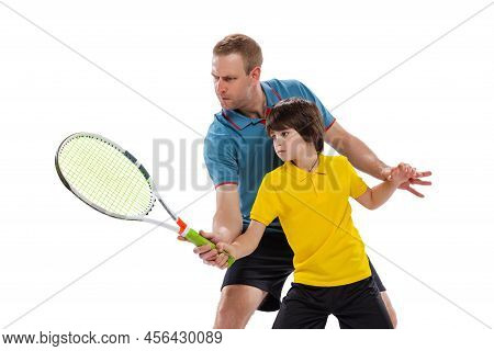 Tennis Lesson. Professional Tennis Player, Instructor Shows Basic Techniques In Game Of Tennis To Sc