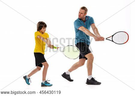 Tennis Lesson. Professional Tennis Player, Instructor Shows Basic Techniques In Game Of Tennis To Sc