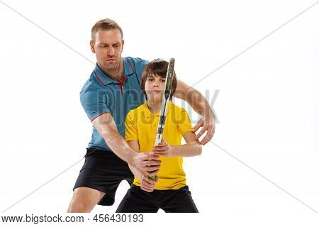 Tennis Lesson. Professional Tennis Player, Instructor Shows Basic Techniques In Game Of Tennis To Sc