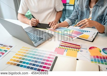 Team Of Creative Graphic Designer Working On Color Swatch Samples Chart For Selection Coloring In In