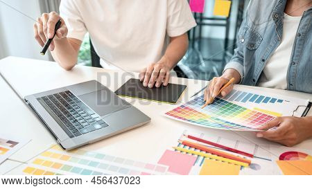 Two Creative Graphic Designer Team Working On Color Selection And Drawing On Graphic Tablet, Color S