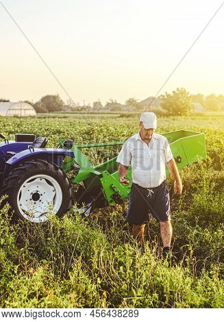 The Farmer Inspects The Work Done In The Farmer's Field. Agricultural Business, Entrepreneurship And