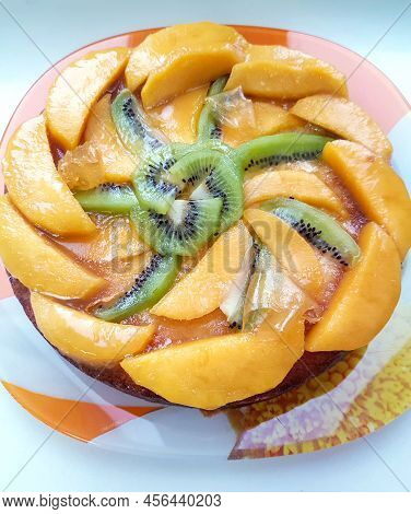 Glazed Fruit Flan Or Pie With Sliced Kiwi Fruit And Peach, Top View.