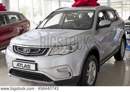 Russia, Izhevsk -august 14, 2020: Geely Showroom. New Modern Atlas Off-road Car In Dealer Showroom. 