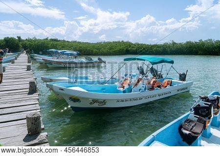 Felipe Carrillo Puerto, Quintana Roo, Mexico - February 05.2022 Motor Boats Are Moored To A Wooden P