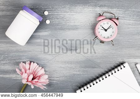 Women Health, Middle Age And Menopause Concept. Health Care Style. Copy Space. White Plastic Bottle 
